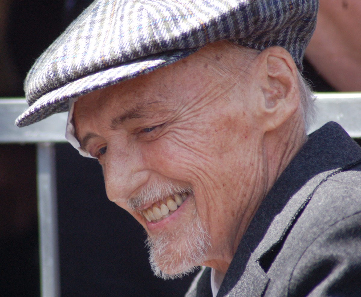 Dennis Hopper wearing a tweed flat cap